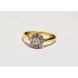 A diamond cluster ring, finger size J1/2 approximately (sizing beads to inner shank). Stamped 'CT&