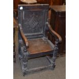 An 18th century oak Wainscott chair, carved panelled back, scroll arms, solid seat, turned supports