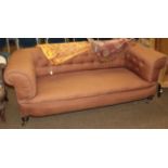 A Victorian Chesterfield sofa, the back-right leg engraved J.R.A