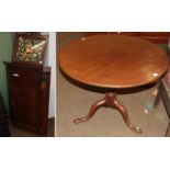 A George III mahogany tilt top tripod table with birdcage action, a George III oak wall hanging