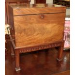 A 19th century mahogany cellarette, raised on a later on stand, fitted with brass campaign