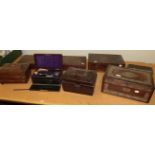 Two Victorian writing slopes, a leather bound travelling vanity set, a gun case and three other