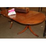 An early 20th century mahogany twin pedestal dining table with one additional leaf, 208cm fully