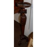 A 19th century carved walnut torchere, 108cm high