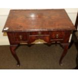 An 18th century walnut low boy, with quarter veneered top