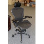 A Herman Miller, modern, medium sized swivel office armchair