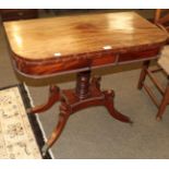 A regency mahogany fold over card table