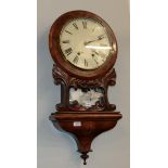 A walnut veneered inlaid drop dial striking wall clock