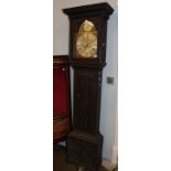 ~ A carved oak eight day longcase clock, arch brass dial signed Peter Hogg, Felton, 18th century and