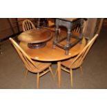 Ercol light elm drop leaf table, together with four matching chairs