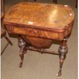 A Victorian walnut games/sewing table