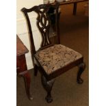 An 18th century carved mahogany dining chair with drop in seat, raised on carved fore legs