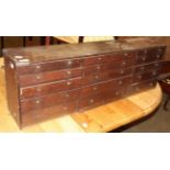 A 19th Century oak fifteen drawer chest, 107cm wide