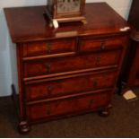 A Georgian style walnut and crossbanded chest of drawers