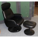 A modern black swivel chair and footstool