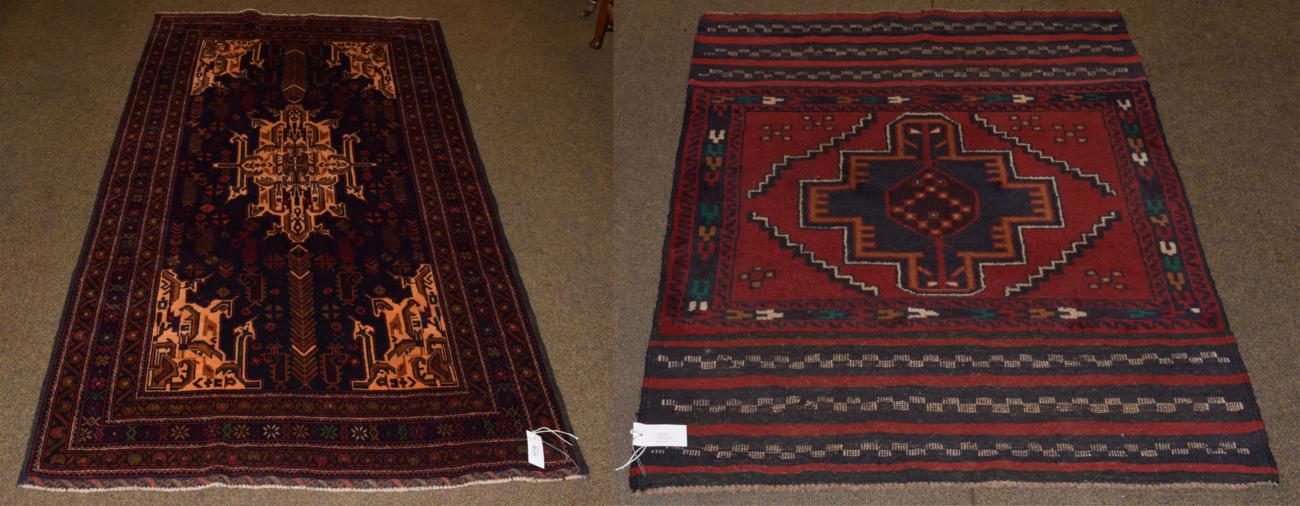 Baluch rug, the field of tribal devices around a central medallion framed by triple borders, 206cm