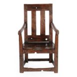 A 19th Century Joined Oak Armchair, possibly Isle of Man, the back support with two vertical