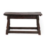 An Early 18th Century Double Oak Joint Stool, the rectangular top with chip carved edge above a