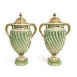 A Pair of Gilt Metal Sèvres Style Porcelain Vases and Covers, circa 1900, of wrythen fluted ovoid