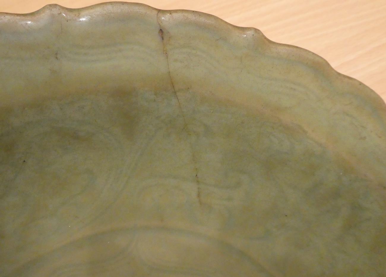 A Longquan Celadon Dish, Ming dynasty, carved with lattice and scrolls within an Arabesque border, - Image 4 of 15