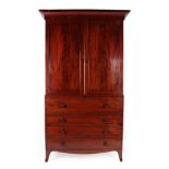 A Regency Mahogany and Ebony Strung Secretaire Linen Press, early 19th century, the bold cornice