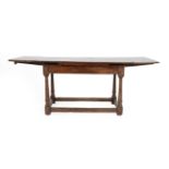 A Joined Oak Refectory Style Table, of attractive proportions, the four-plank top with cleated