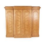 A Victorian Burr Ash Breakfront Wardrobe, circa 1870, the moulded cornice above four moulded