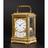 A Fine Brass Engraved Strike and Repeat Grande Sonnerie Alarm Carriage Clock with Calendar Displays,