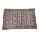 Ghom Carpet Central Iran, circa 1930 The ivory field with an all over design of flower heads and