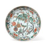 A Chinese Porcelain Charger, Kangxi, painted in famille verte enamels with a bird perched in a
