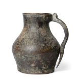 A Medieval Copper and Brass Jug, probably 14th century, of baluster form with brass scroll handle,