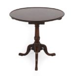 A George III Mahogany Tripod Table, circa 1760, the circular top with moulded edge, on a turned