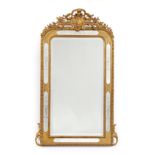 A French Gilt and Gesso Overmantel Mirror, circa 1870, the central bevelled glass plate flanked by
