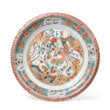 A Chinese Porcelain Charger, Kangxi, painted in famille verte enamels with a phoenix amongst foliage