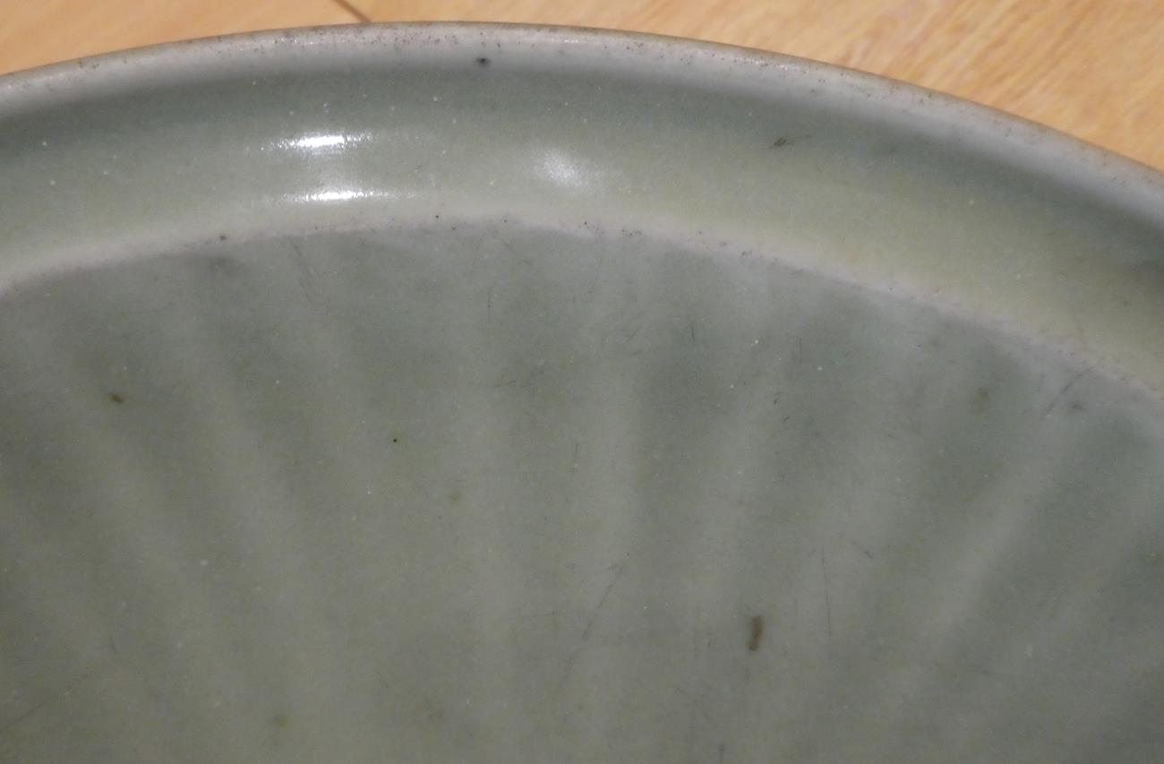 A Longquan Celadon Dish, Ming dynasty, carved with a central foliate panel within a broad fluted - Image 4 of 11