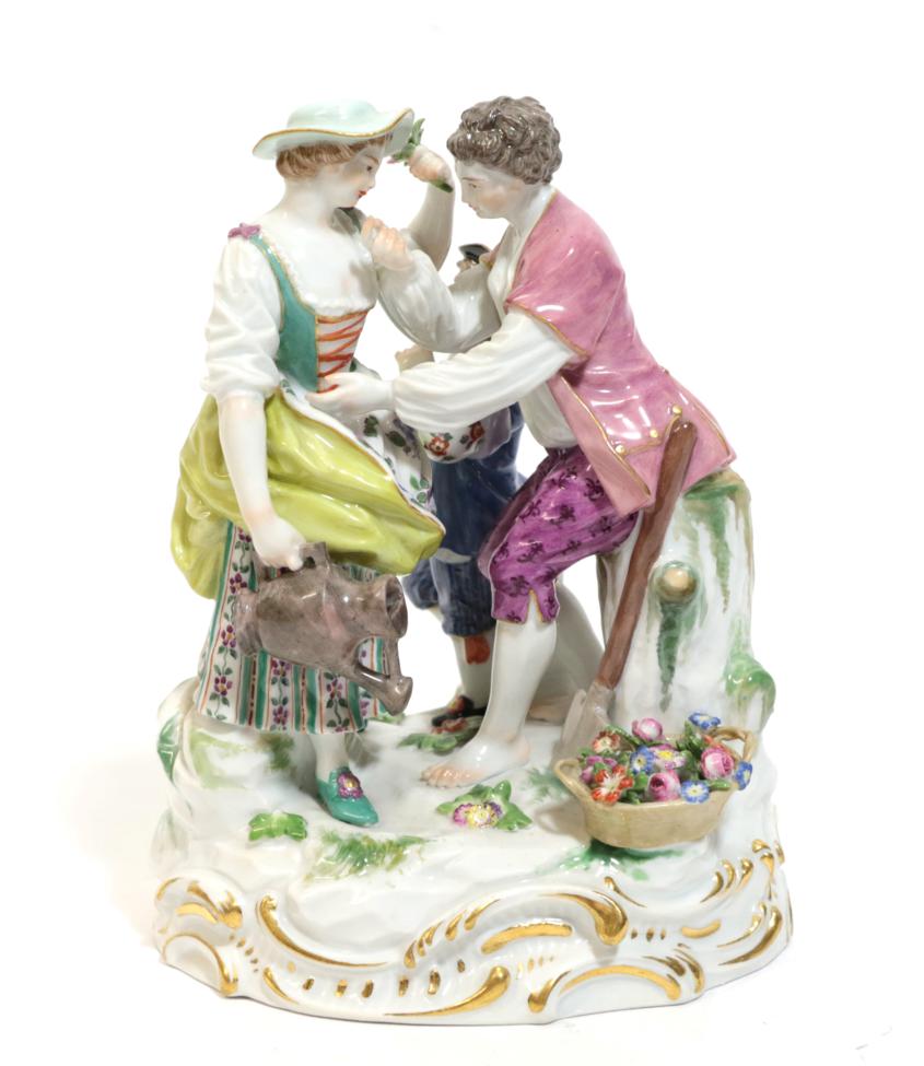 A Meissen Porcelain Figure Group, late 19th/early 20th century, modelled as a gardener and