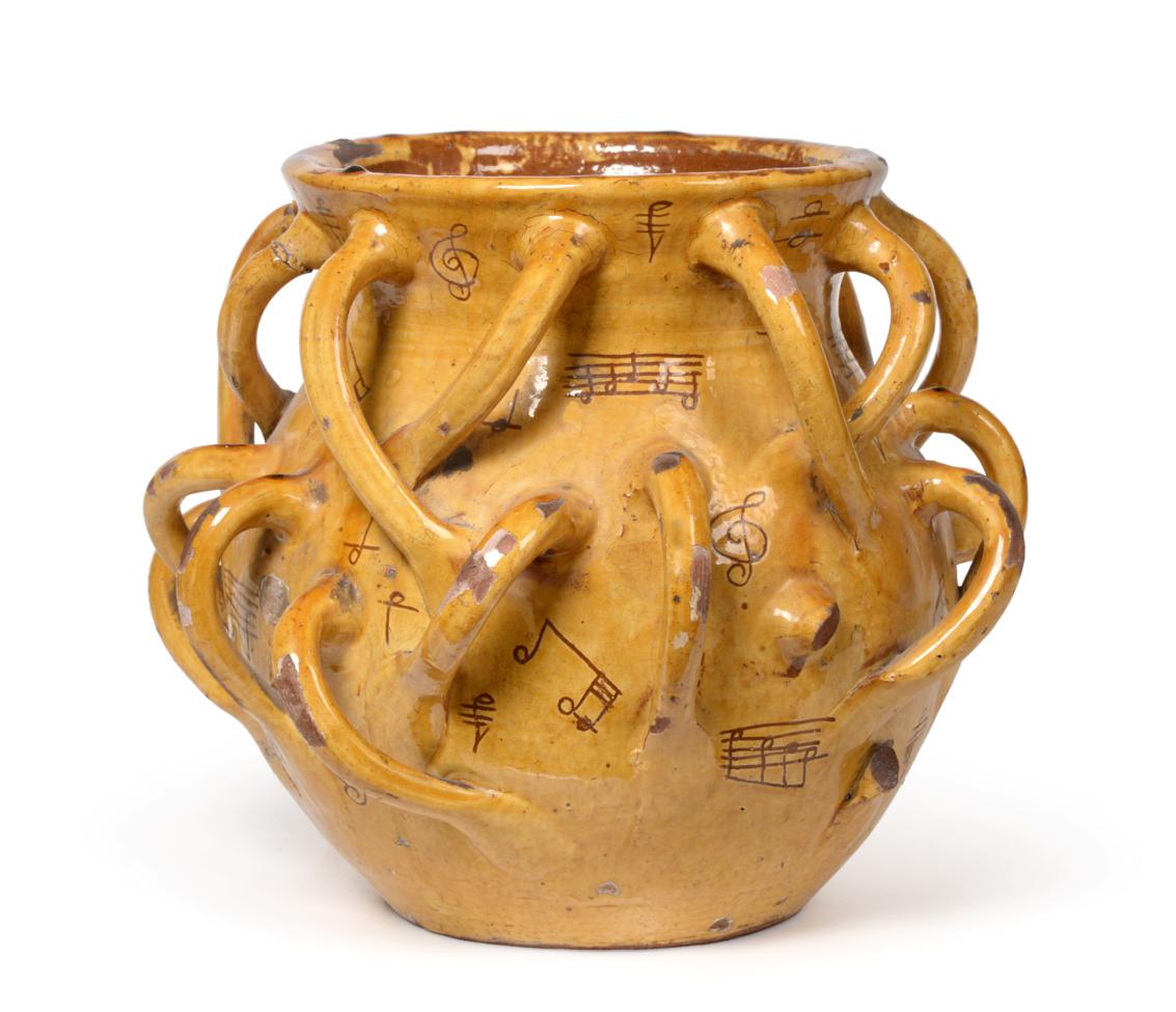 A Ewenny Slipware ''Musical Notation'' Wassail Bowl, 19th century, of baluster form with flared neck