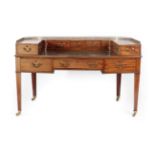 A Late George III Mahogany Carlton House Desk, early 19th century, of large proportions, with