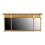 A Regency Gilt and Gesso Triptych Overmantel Mirror, early 19th century, of breakfront form with