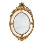 A French Gilt and Gesso Oval Marginal Mirror, circa 1880, the original mirror plate within a