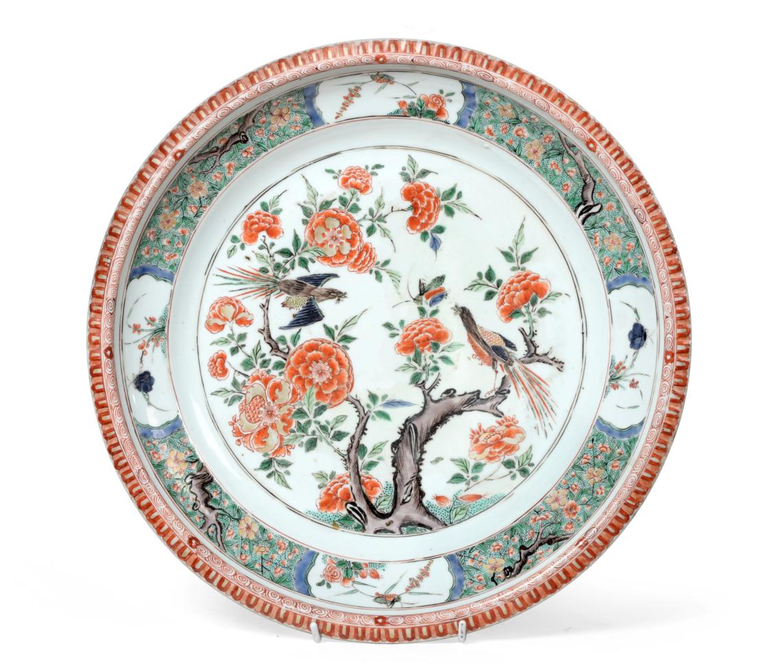 A Chinese Porcelain Charger, Kangxi, painted in famille verte enamels with a birds amongst flowering