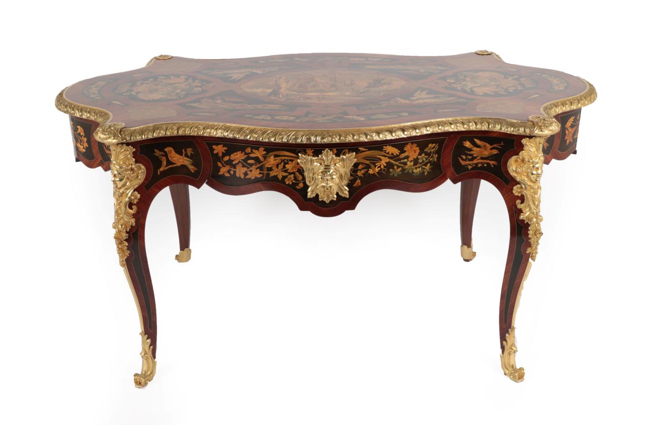 An Impressive Louis XV Style Marquetry Decorated and Ormolu Mounted Centre Table, the shaped top