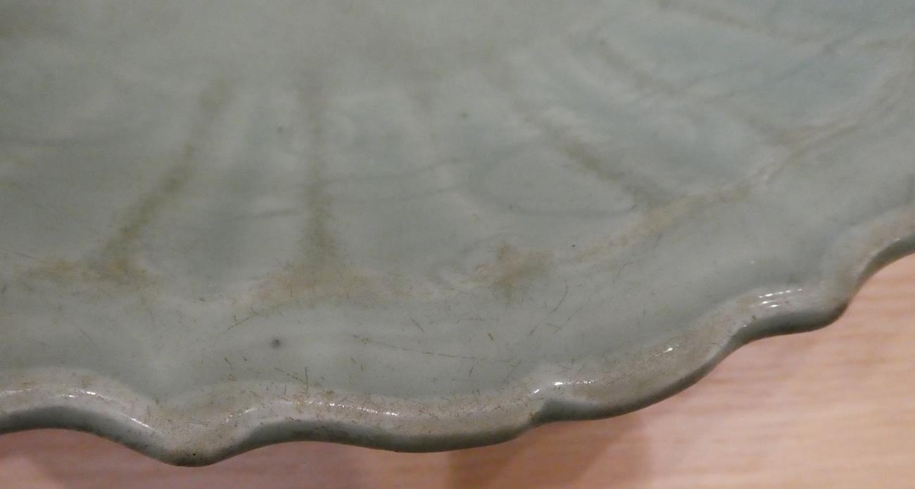 A Longquan Celadon Dish, Ming dynasty, carved with lattice and scrolls within an Arabesque border, - Image 14 of 15