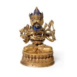 A Tibetan Gilt-Bronze Figure of Guhyasamaja Akshobhyavajra and Consort, 18th century, the three-