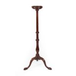 A George III Mahogany Candle Stand, 3rd quarter 18th century, the circular top above a baluster