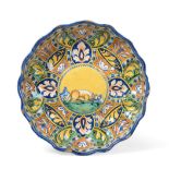 A Faenza Maiolica Crespina, circa 1550, of lobed circular form, painted in colours with a