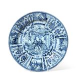 A Dutch Delft Dish, late 17th century, painted in blue in Kraak style with central European