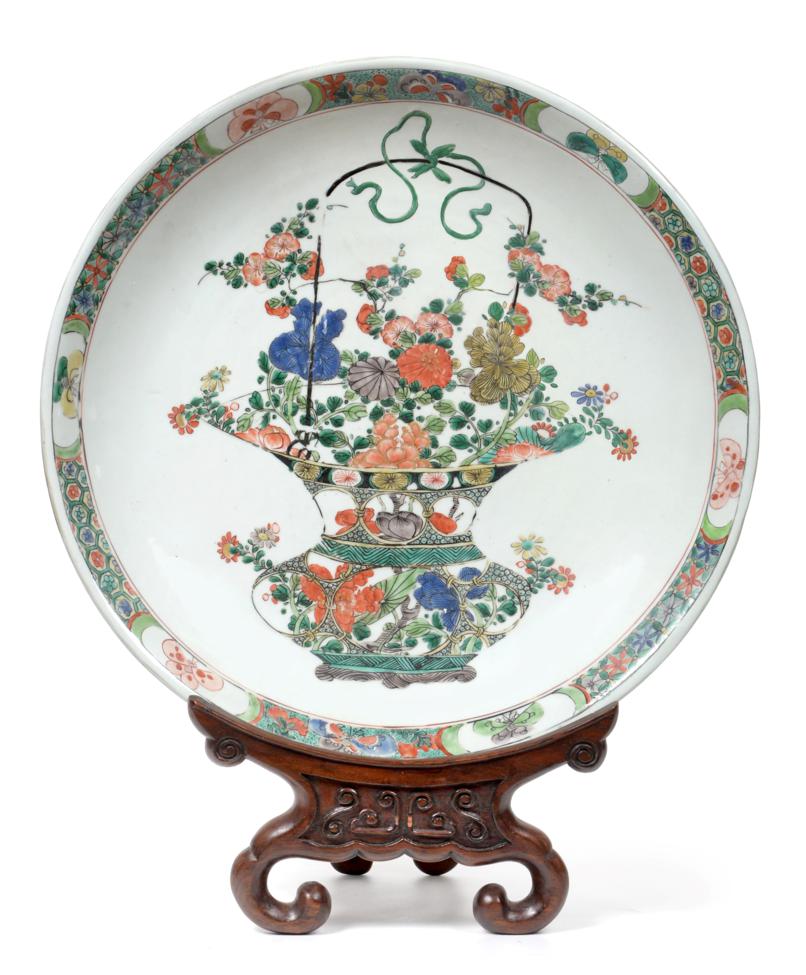 A Chinese Porcelain Dish, Kangxi, painted in famille verte enamels with a basket of flowers within a