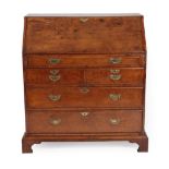 A George III Burr Elm Bureau, 2nd half 18th century, the fall enclosing a fitted interior of