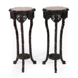 A Pair of Early 20th Century Chinese Padouk Wood and Pink Marble Plant Stands, the circular marble